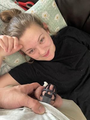 She’s so amused by his caged cock!