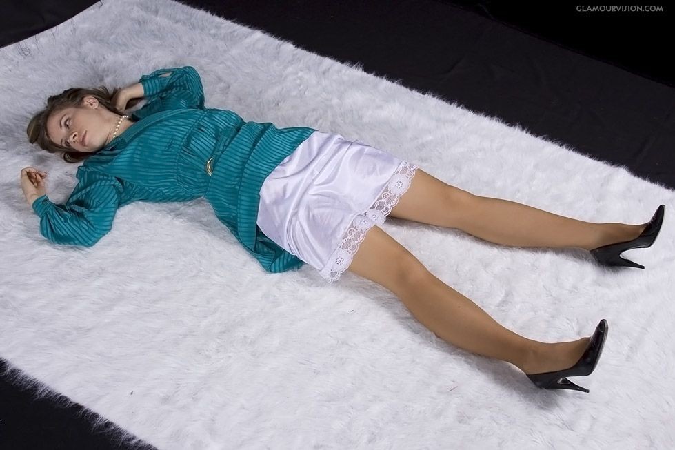 Teal lying on carpet.