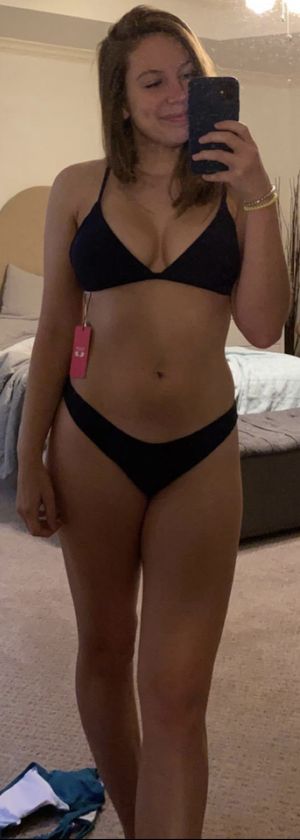 Trying on her new bikini and sending out selfies to her friends
