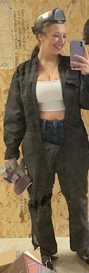 Trin in coveralls showing cleavage