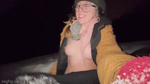 topless sled ride selfie