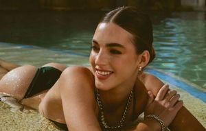 Emily laying down smiling showing ass