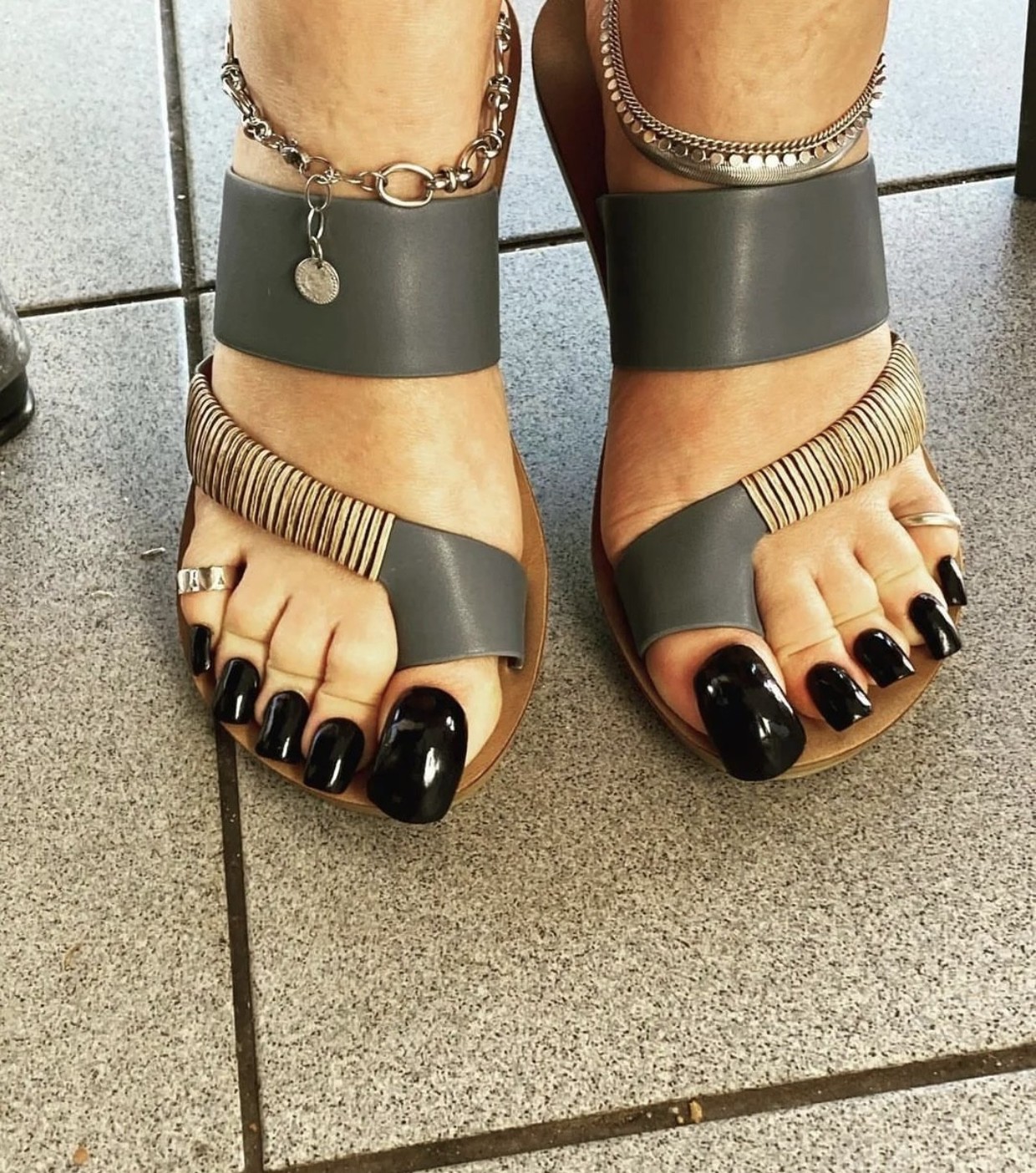 Dark long toenails.