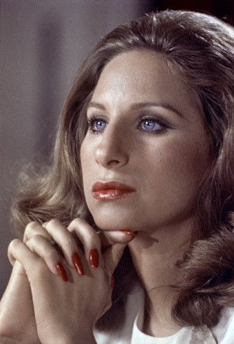 Red nails sometimes were synonymous with her.