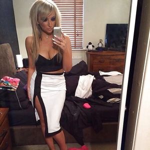 Hot blonde with cleavage & white nails. Post your true rate.