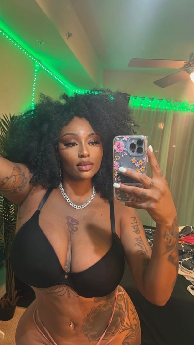 Sophia Ifeoma taking a selfie in her bra and thong