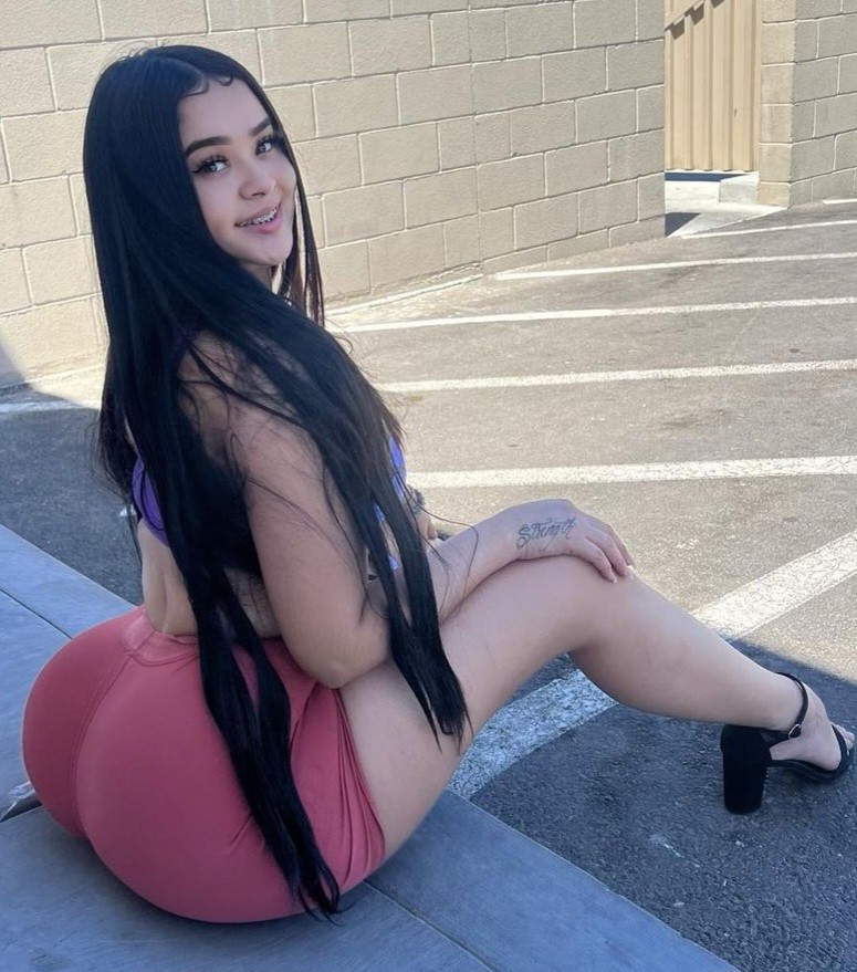 Val sitting on curb