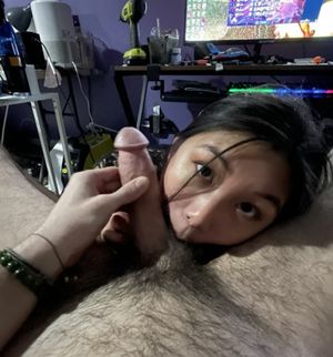 Asian amateur sucking the balls of an average-sized cock