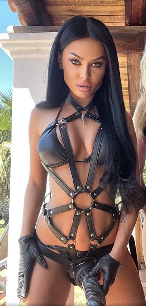 Pretty brunette Evil Woman strapon tease...