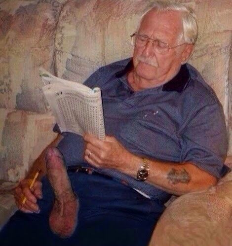 Old man solving word puzzle with hard cock