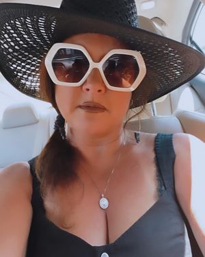 Lip stick on, shades on, cleavage showing...good job