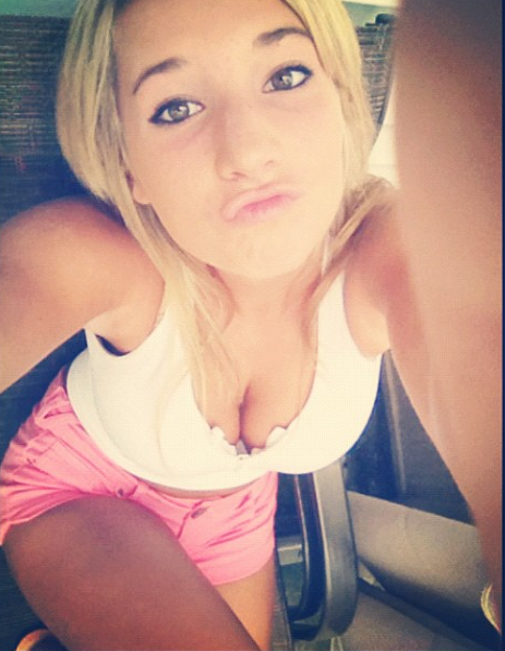 Blonde taking selfie with cleavage. Post your true rate.