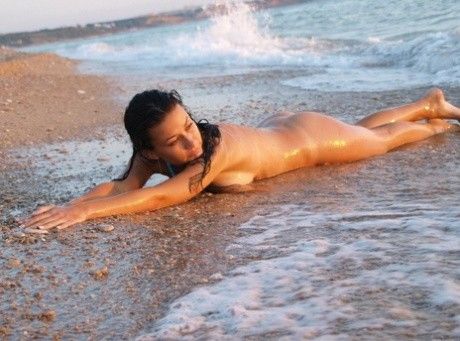 letting the waves roll over her