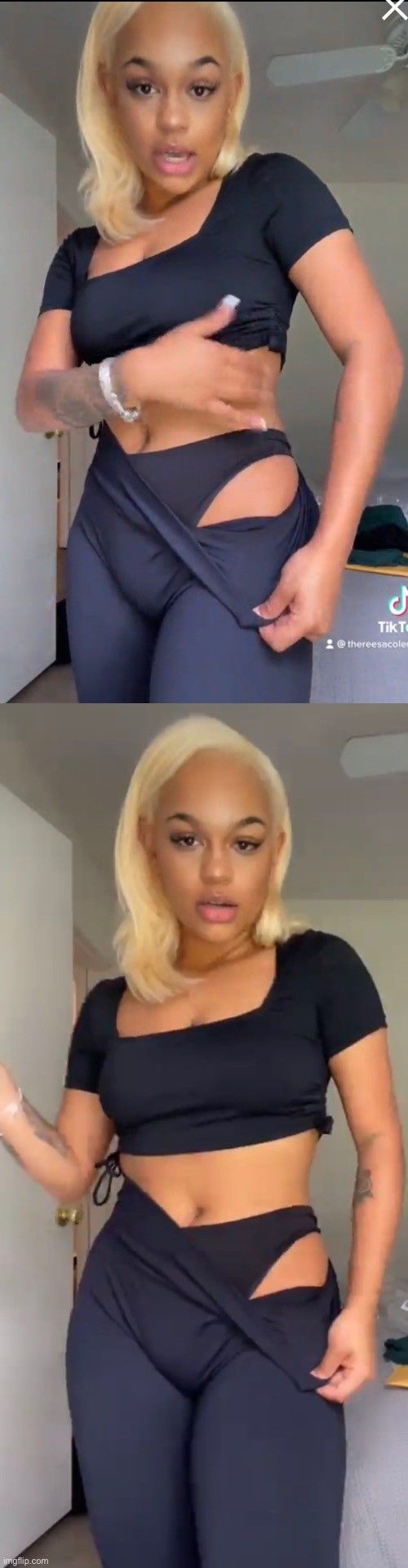 Black girlie showing off her panties.