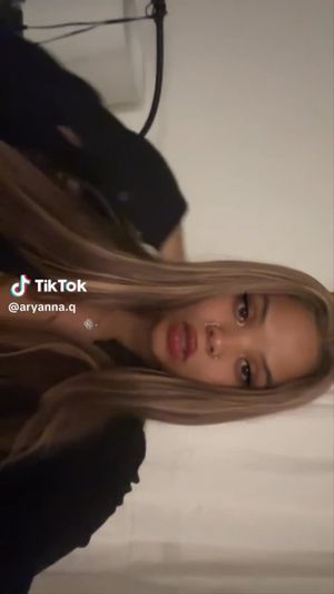 Busty black thot showing off tits on tik