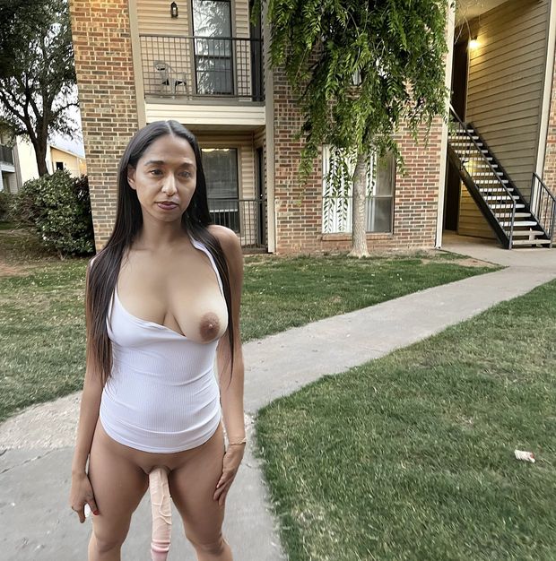 Traci walking around outside of our apartment with dildo in pussy