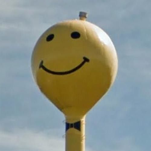 Smiley face water tower with bow tie.