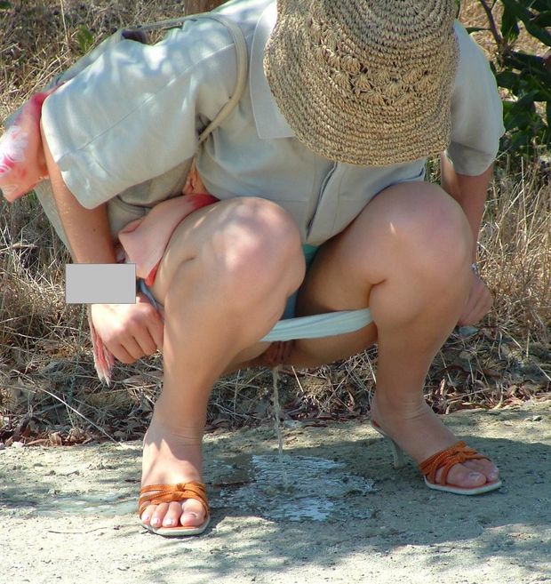 Blonde slut pisses outdoor like a dog