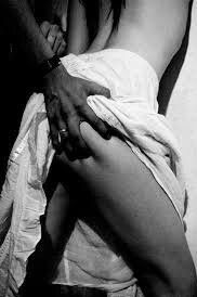 He pushed me up against the wall slid his big black hand up my silky white thigh lifting my skirt then squeezed my bum