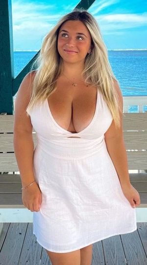 Kate white dress on dock looking left