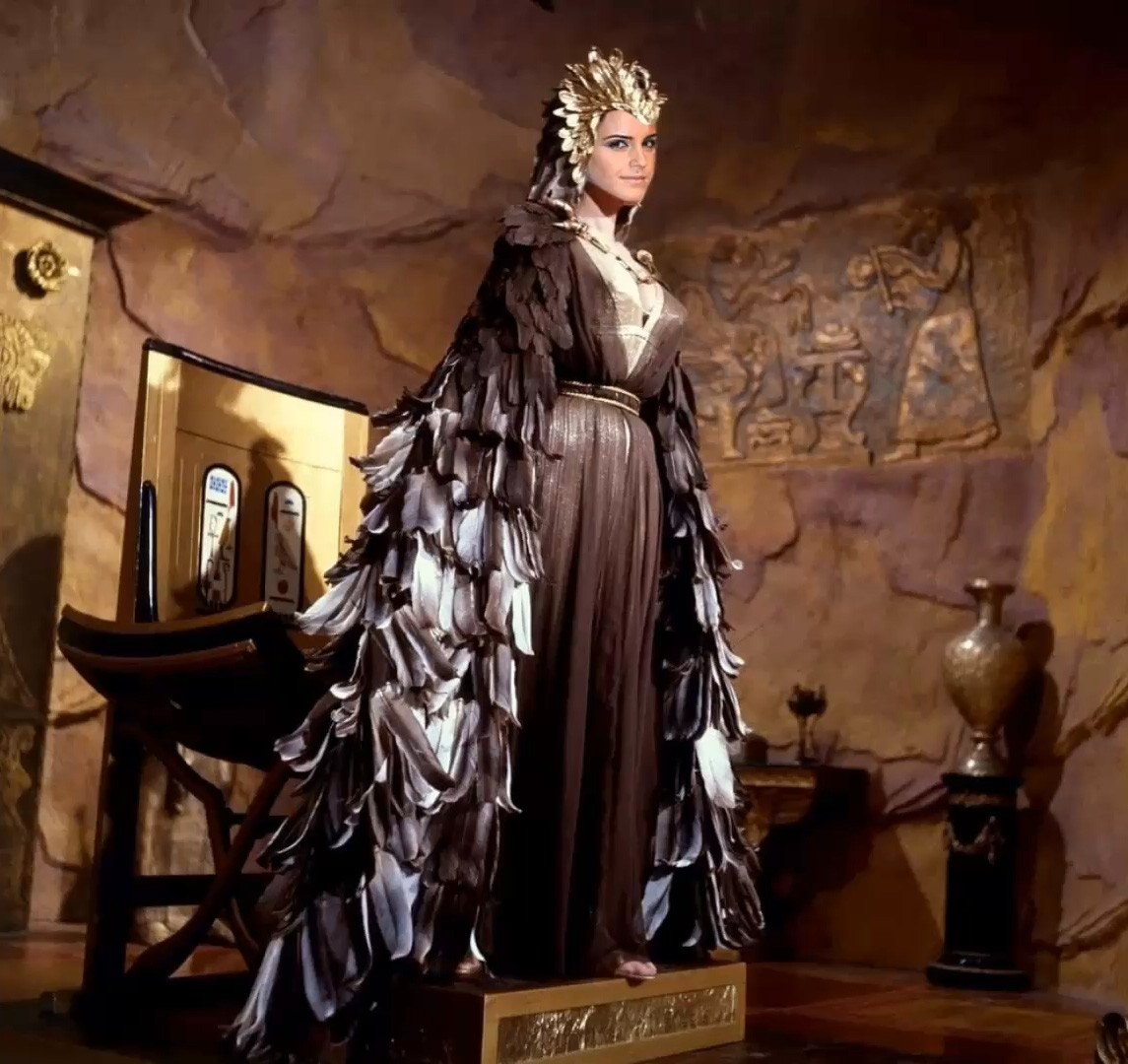 Queen Emma Watson in feather robe
