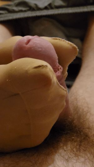 Milf squeezes cock with her nylon feet