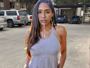 Traci standing outside our apartment complex with cum on her face