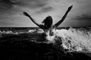 Nude in the waves