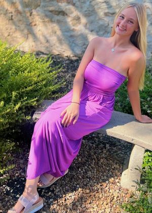 Anya purple dress sitting on bench